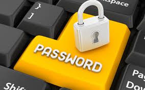 Yellow password key with padlock on keyboard.