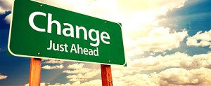 Change ahead sign with cloudy sky background.